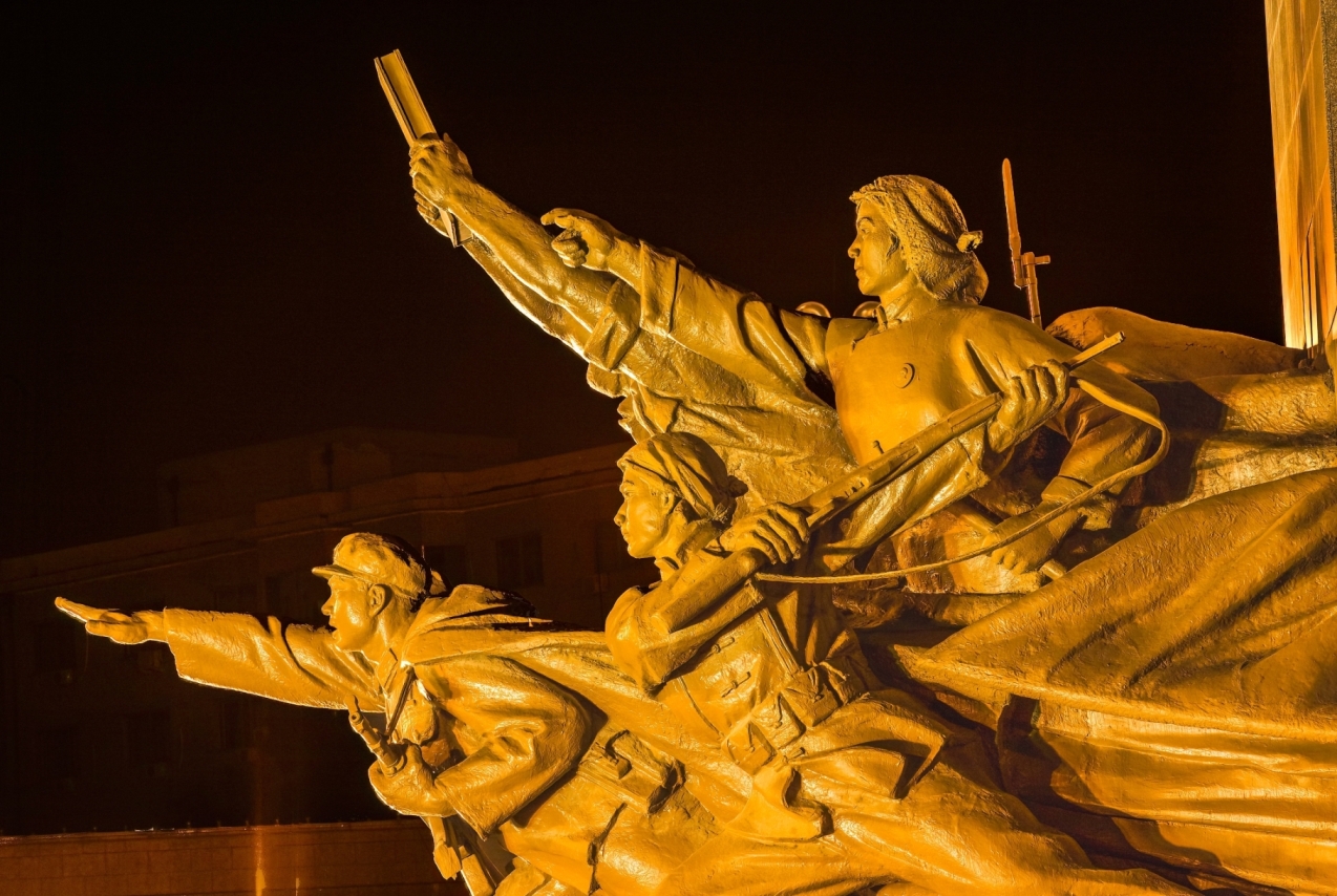 Mao Zedong Statue Heroes Zhongshan Square Shenyang Liaoning Province China Night Built 1969 during Cultural Revolution Hero holding copy of Mao Zedong Thought