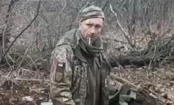 A screenshot from the video of a public execution of a soldier after his words, "Glory to Ukraine!"[12]